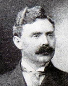 Black and white portrait of John D Maxwell